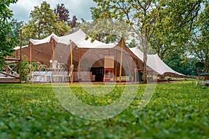Image of huge tent for a wedding event in the nature