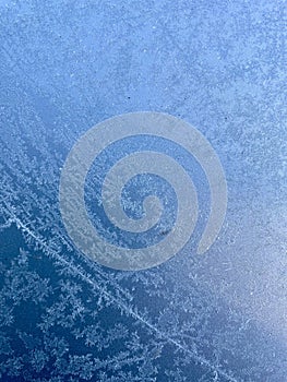 Ice patterns forming on metal