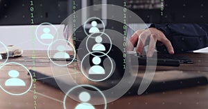 Image of icons and data processing over businessman using computer working in office