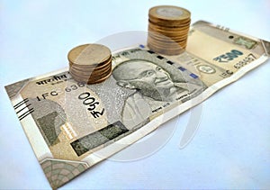 Image of Indian currency. Indian rupees coins placed on500 rupees Indian currencynotes.