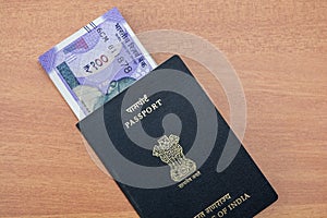 Image of Indian passport and new Indian paper currency