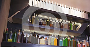 Image of interior of bar with rows of bottles