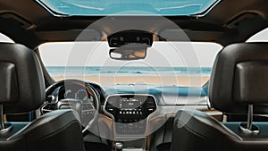 Image of the interior of a car parked on the beach