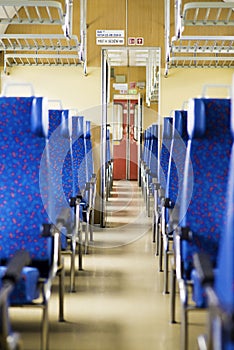 Image with the interior of a Czech train. An older train with comfortable and colorful chairs. - Image, Sign in