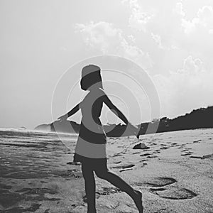 image of an introverted girl trying to publish herself to the universe. A deserted beach is the most comfortable place for her.