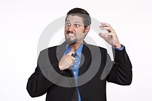 Image of a irritated businessman pulling his necktie