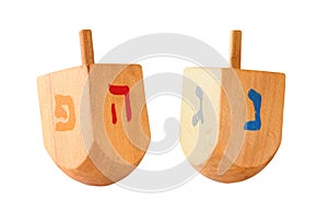 wooden colorful dreidels (spinning top) for hanukkah jewish holiday isolated on white