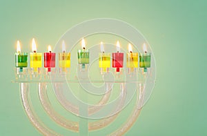 image of jewish holiday Hanukkah background with crystal menorah (traditional candelabra)