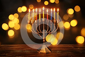 image of jewish holiday Hanukkah background with menorah & x28;traditional candelabra& x29; and burning candles