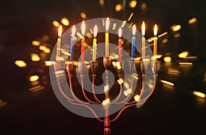 image of jewish holiday Hanukkah background with menorah & x28;traditional candelabra& x29; and burning candles