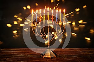 image of jewish holiday Hanukkah background with menorah & x28;traditional candelabra& x29; and burning candles