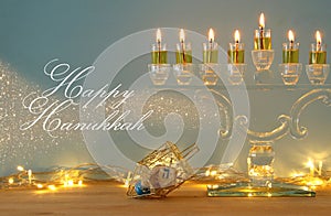 image of jewish holiday Hanukkah background with menorah & x28;traditional candelabra& x29; and burning candles.