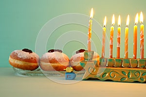 image of jewish holiday Hanukkah background with menorah & x28;traditional candelabra& x29;. Selective focus.