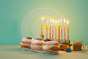 image of jewish holiday Hanukkah background with menorah & x28;traditional candelabra& x29;. Selective focus.