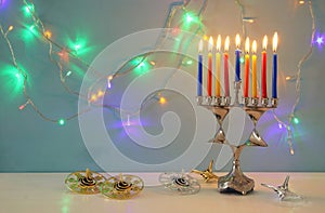 image of jewish holiday Hanukkah background with menorah & x28;traditional candelabra& x29; and burning candles