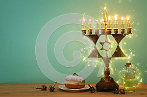 image of jewish holiday Hanukkah background with menorah & x28;traditional candelabra& x29; and burning candles.