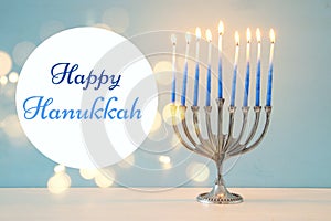 image of jewish holiday Hanukkah background with traditional menorah & x28;traditional candelabra& x29; and burning candles