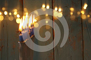 image of jewish holiday Hanukkah background with traditional menorah & x28;traditional candelabra& x29; and burning candles