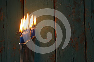 image of jewish holiday Hanukkah background with traditional menorah & x28;traditional candelabra& x29; and burning candles