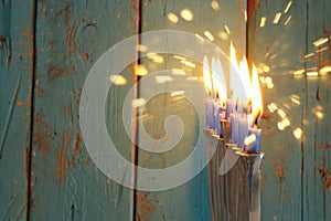 Image of jewish holiday Hanukkah background with traditional menorah & x28;traditional candelabra& x29; and burning candles