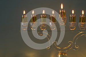 image of jewish holiday Hanukkah background with traditional spinnig top, doughnuts and menorah