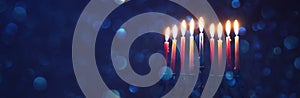 image of jewish holiday Hanukkah background with traditional spinnig top, menorah & x28;traditional candelabra& x29;.