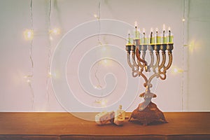 Image of jewish holiday Hanukkah background with traditional spinnig top, menorah & x28;traditional candelabra& x29;