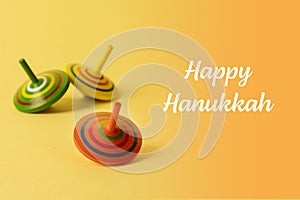 Image of Jewish holiday Hanukkah with menorah donuts and wooden dreidels doughnut, chocolate coins