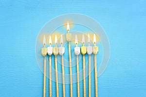 Image of jewish holiday Hanukkah with wooden dreidels collection (spinning top) as menorah