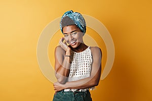 Image of joyful african american woman posing and laughing on camera