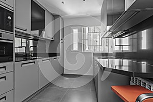 Image of a kitchen with gray wood cabinets to match the flooring,