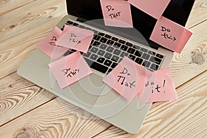 Image of laptop full of sticky notes reminders on screen. Work overload concept image. Coworking or working at home concept image