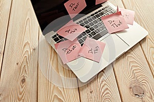 Image of laptop full of sticky notes reminders on screen. Work overload concept image. Coworking or working at home concept image