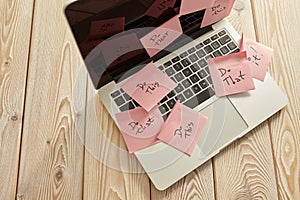 Image of laptop full of sticky notes reminders on screen. Work overload concept image. Coworking or working at home concept image