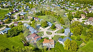 Large overlook of suburban neighborhood homes and houses aerial