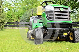 An image a of lawn mowing - blurry