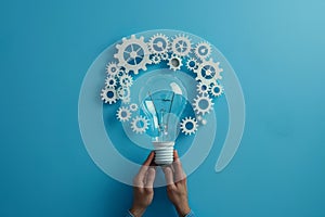 An image of a light bulb with white gears around it, isolated on a blue background. SEO technology concept. Copy space