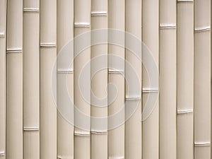 Texture of a light yellow bamboo pattern wall