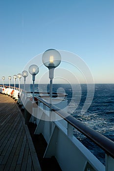 Lighting lanterns on the upper deck of a cruise ship photo