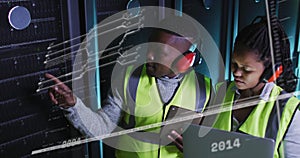 Image of lines and numbers over african american man and woman working in server room