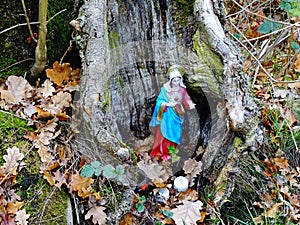 Image of little Holy Mary statue, put into an old trunk for worshipping