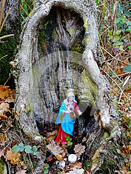 Image of little Holy Mary statue, put into an old trunk for worshipping