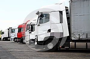 Lorries parked up outside a company`s car parking area