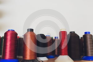 Image of a lot of coils with multi-colored threads.