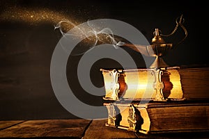 Image of magical aladdin lamp with glitter smoke. Lamp of wishes.