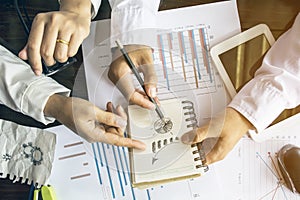 Image of male hand pointing at business document during discussion