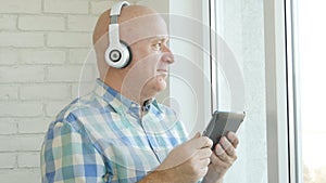 Image with a Man Listening Music with Bluetooth Headphones