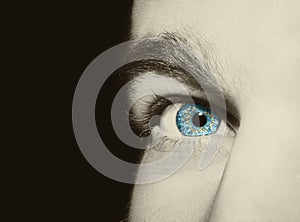 Image of man`s blue eye.