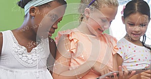 Image of math formulas over diverse pupils learning at school