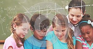 Image of math formulas over diverse pupils at school